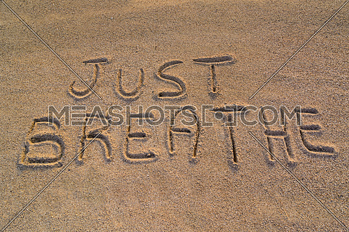 In the picture the words on the sand \