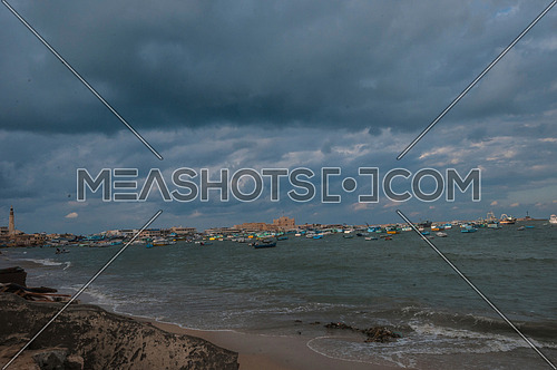 Long Shot for sea shore showing fishing boats and street at alexandria at day
