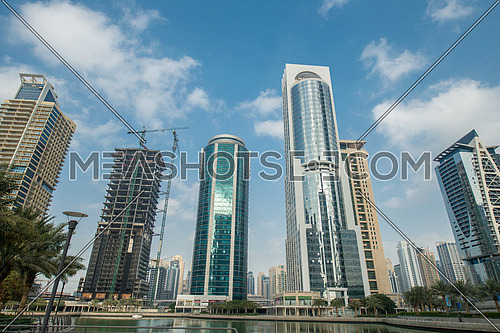 Tall skyscrapers in Dubai near water