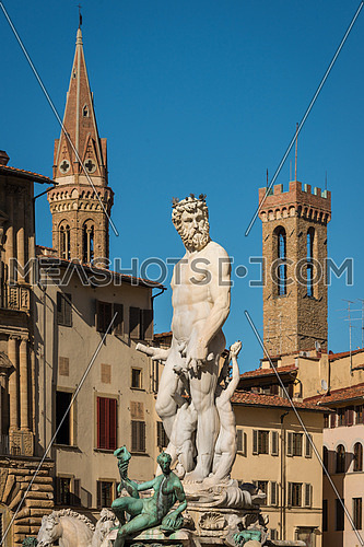 Statue of Neptune with towers in background, Piazza della Signoria, Florence (Italy)