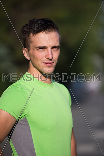 Portrait Of young Male Runner On Urban Street