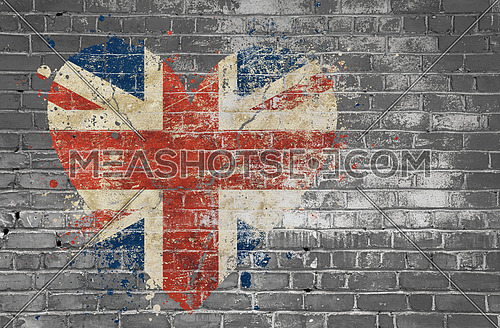 Grunge distressed heqart shaped flag of Britain painted on old weathered grey brick wall