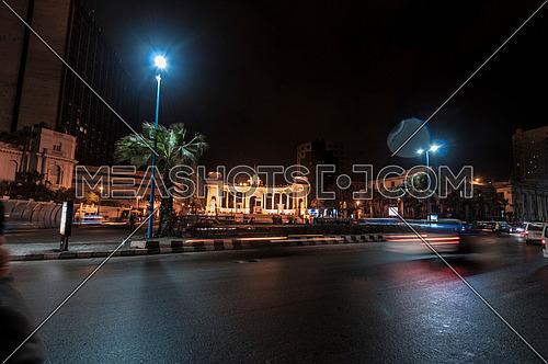 Long long shot for traffic towards Alexandria Naval Unknown Soldier Memorial at night
