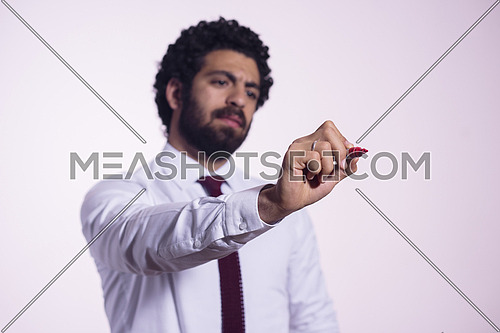 middle eastern business man writing with  marker on virtual screen
isolated on white