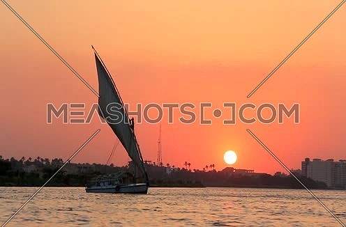 Long shot for the River Nile and a feluka at sunset in Cairo