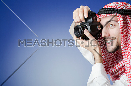 Arab photographer in studio shooting