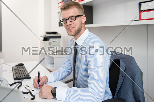 Young Businessman Writing A Letter - Notes Or Correspondence Or Signing A Document Or Agreement