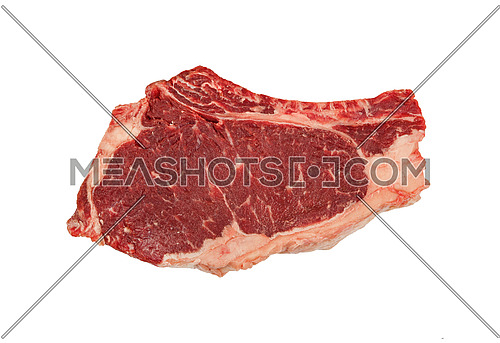 Close up one marbled raw ribeye beef steak with rib bone isolated on white background, elevated top view, directly above