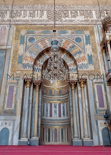 Colorful decorated marble wall with engraved Mihrab (niche) at the Mosque and Madrassa (School) of Sultan Hassan, Cairo, Egypt