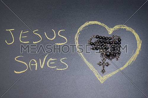 In the picture a rosary iron at the center of a heart drawn on the left side the word \