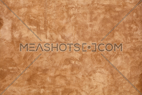 Grunge beige brown faded uneven old aged daub plaster wall texture background with stains and paint strokes, close up