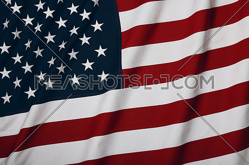 Close up heavy cotton canvas US national flag background, symbol of American patriotism, elevated high angle view, directly above