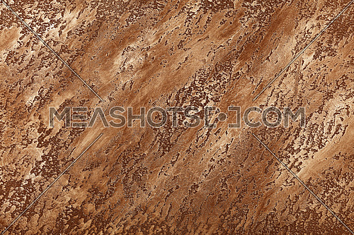 Grunge pastel brown faded uneven old aged daub plaster wall texture background with stains and paint strokes, close up