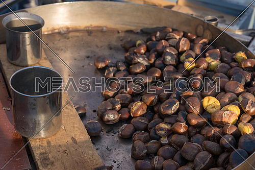 Roast chestnuts cooked over the red-hot grill,