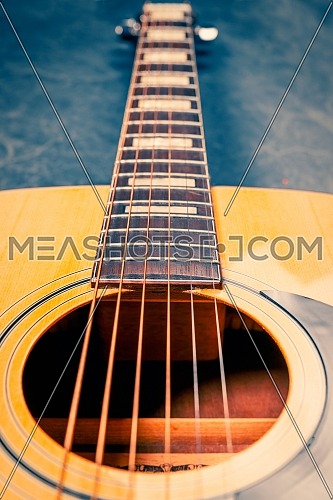 acoustic guitar on marble background,music concept.Vertical photo.