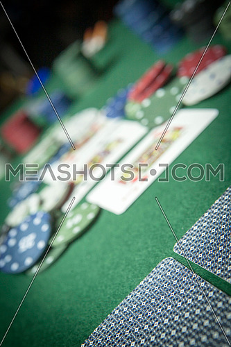 cards poker deck English, poker chips stack on green table