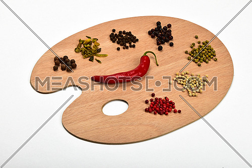 Palette of spices, collection of various spices on wooden palette isolated on white