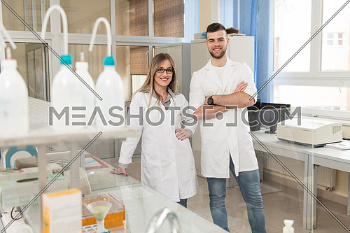 Group Of Scientists Conducting Research In A Lab Environment