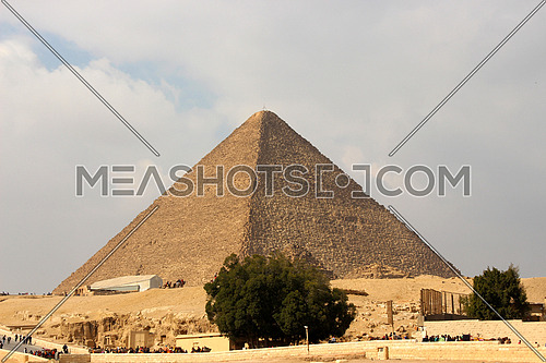 a photo showing the middle pyramid build in Giza during the pharaohs ancient civilization and the architecture style
