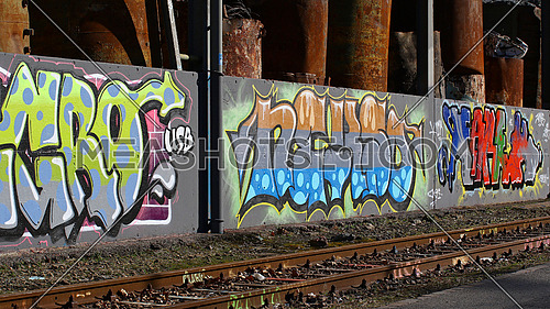 Cadenazzo, Switzerland, February 2016, Urban wall texture along railroad tracks keep popping up along railway tracks, graffiti art abstract background
