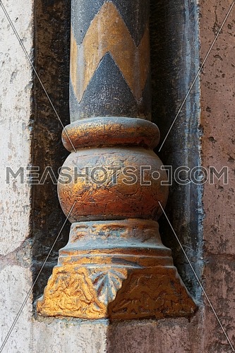 Golden base of a small decorative pillar (column) with engraved floral inscriptions at the ancient public mosque of Sultan Hassan, Old Cairo, Egypt