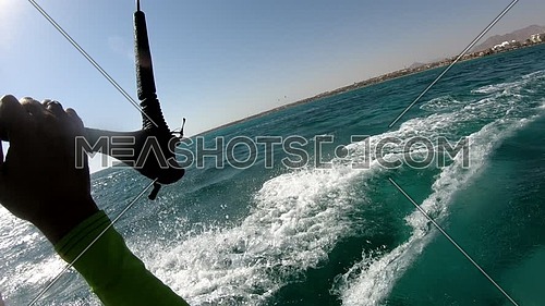 POV shot for Kite Surfer while surfing in Red Sea at day.