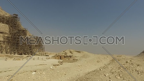 Pan Left shot revealing Saqqara Pyramid at day.