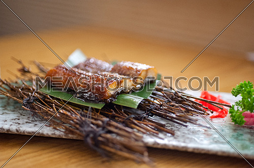 Japanese style roasted eel served on palm leaf