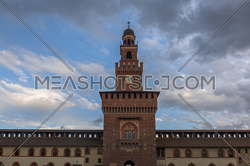 Tower of the Sforza Castle (Castello Sforzesco), a castle in Milan, Italy at twilight.