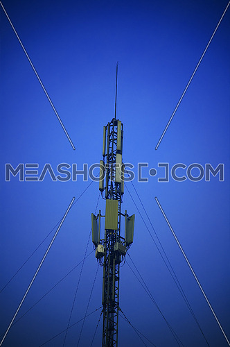 modern telecomunications antenna over a blue sky