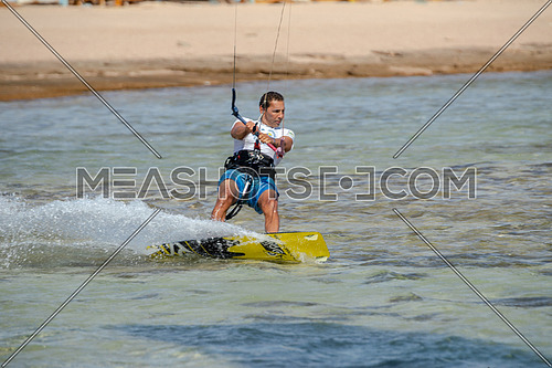 Kite Surfer while surfing in Red Sea at day.