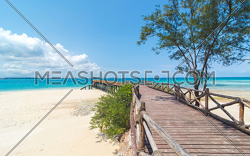 Wooden pier at Prison island near Zanzibar,  Beautiful turquoise water and white sand near Zanzibar, Tanzania