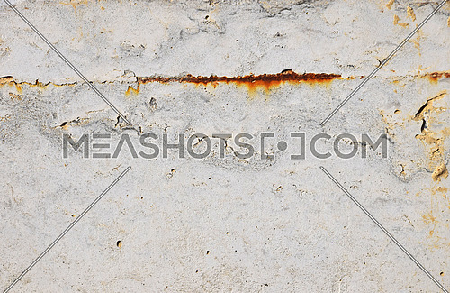 Grunge uneven grey concrete surface background texture with stains of rust