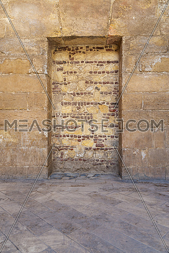 Recessed frame in an old stone bricks wall, Medieval Cairo, Egypt