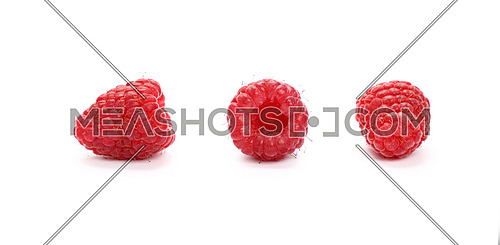 Three fresh red ripe mellow raspberry berries isolated on white background, detail close up in different perspectives, low angle view