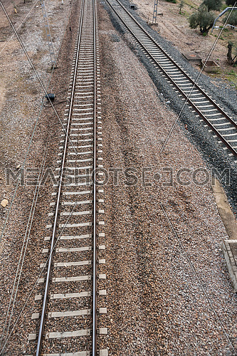 iron rusty train railway detail over dark stones rail way