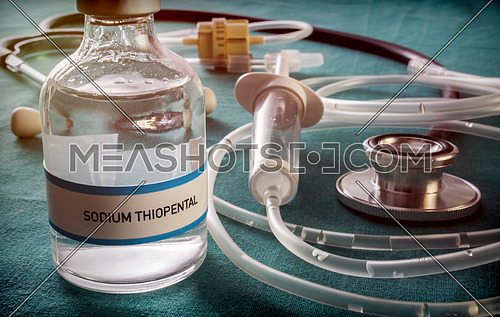 Vial with Sodium Thiopental next to stethoscope and syringe in a hospital, conceptual image