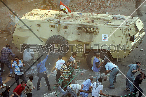 protesters attack armored forces of the armed forces in front of the Ministry of Finance of egypt on the day of the dismantling Rabaa al-Adawiya Square sit-in On 14 August 2013
