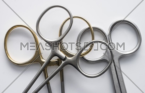 Various metal scissors isolated on white background, conceptual image