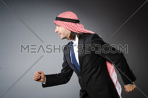 Arab businessman againt grey background