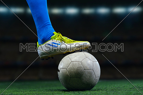 soccer player doing kick with ball on football stadium