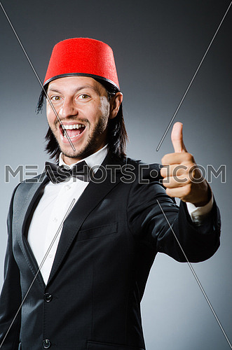 Man in traditional turkish hat and dress