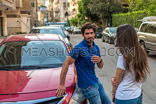 young couple having a discussion in the street in korba area at day