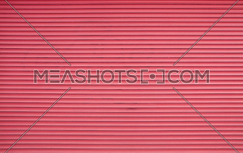 Vivid pink painted horizontal metal window roller shutter blinds or garage doors background texture