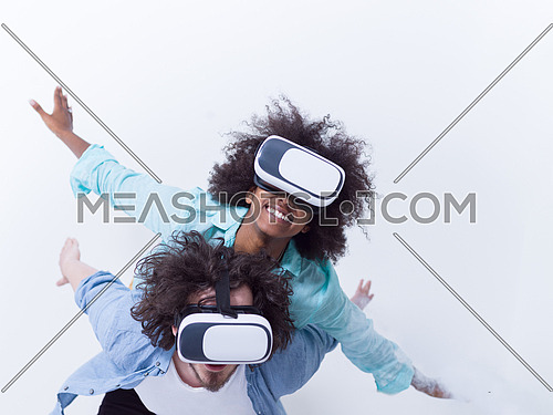 Happy multiethnic couple getting experience using VR headset glasses of virtual reality, isolated on white background
