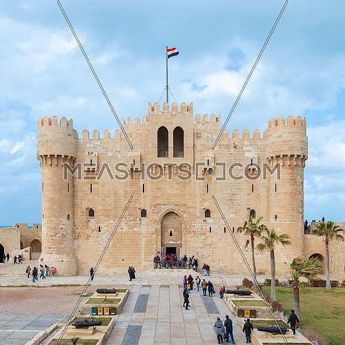 Alexandria, Egypt - January 25, 2018: Citadel of Qaitbay, a 15th century defensive fortress located on the Mediterranean sea coast, established in 1477 AD with local residents visiting the place