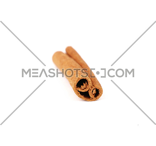 Close up one cinnamon stick isolated on white background, high angle view