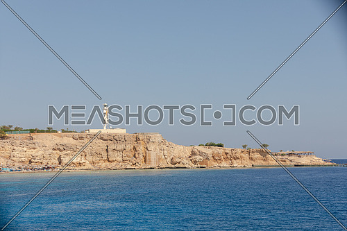 Long shot from the Red Sea showing Ras Muhammed Island by day