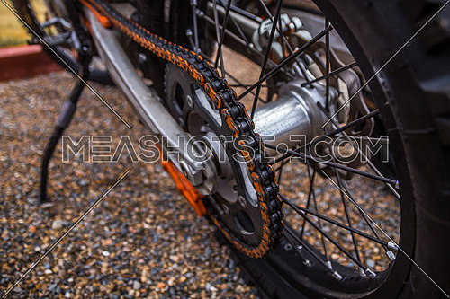wheels of dirt bike on gravel