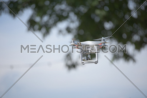 aerial photography,  quadcopter  drone flying over the city. New digital photo and video technology
